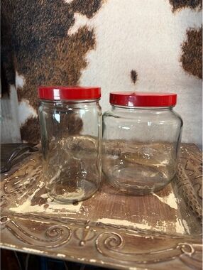 Set of 2 vintage Anchor Hocking glass jars featuring their icon red lids